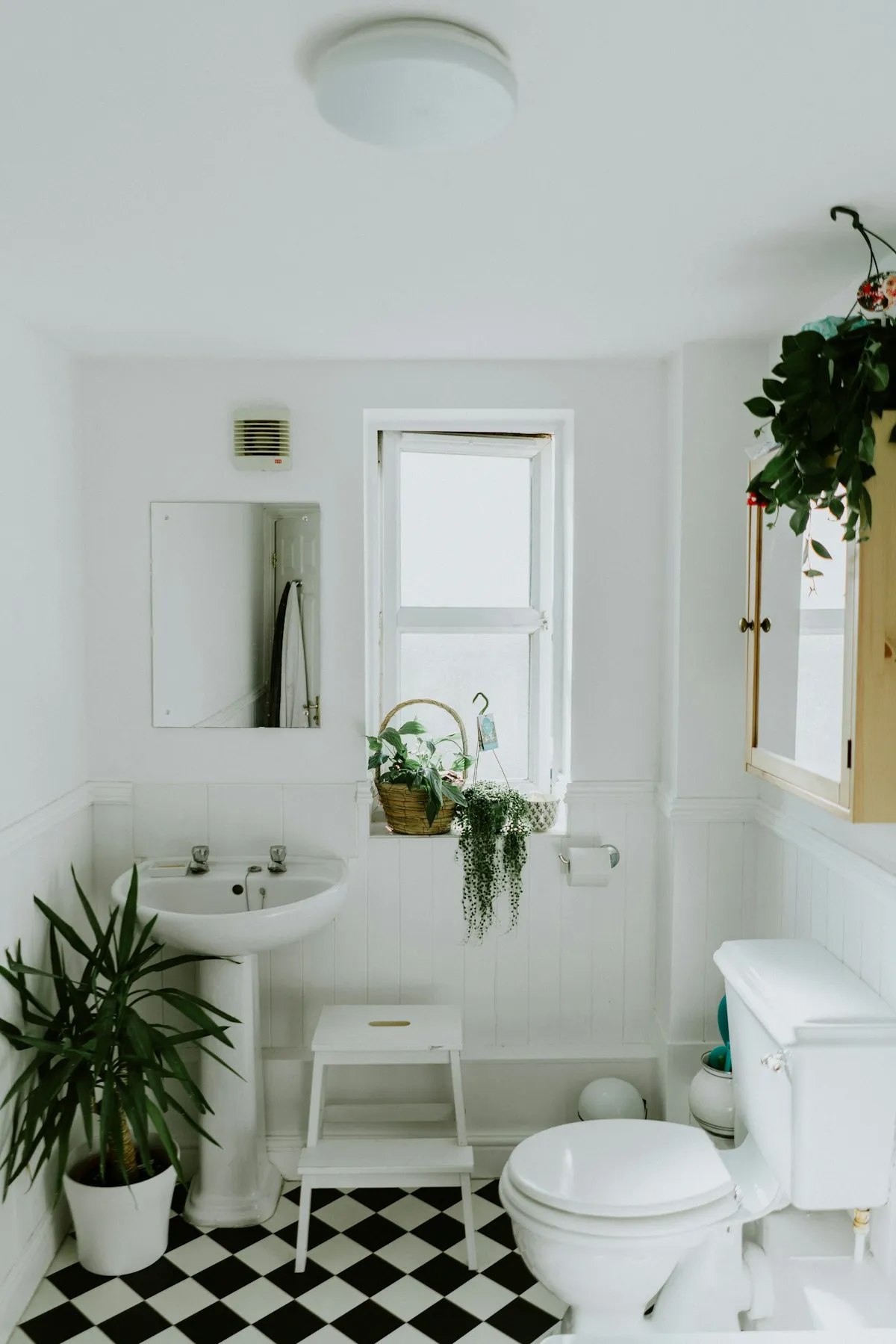 Modern bathroom remodel with white tile and contemporary fixtures in Omaha home