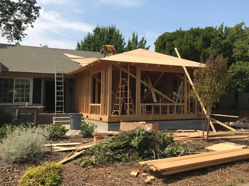Room addition framing in progress on a residential home